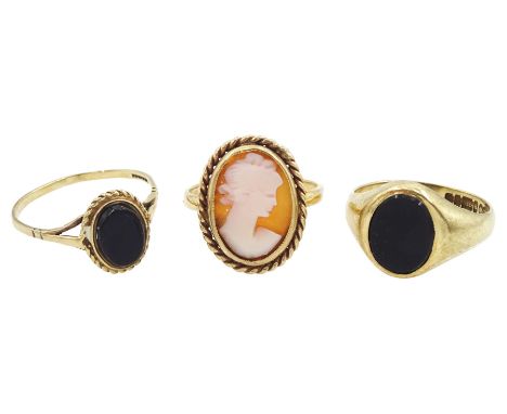 Two gold oval onyx rings and a gold cameo ring, all 9ctCondition Report:Approx 6.4gm, sizes J, I and O