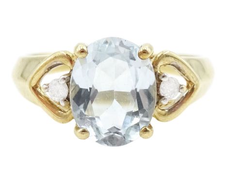 9ct gold three stone oval cut blue topaz and round brilliant cut diamond ring, hallmarkedCondition Report:Approx 2.55gm, size