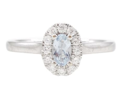 18ct white gold oval cut aquamarine and round brilliant cut diamond cluster ring, Birmingham 2014, total diamond weight appro