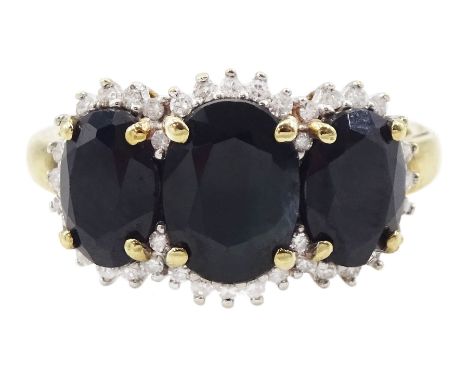 9ct gold three stone oval cut sapphire and round brilliant cut diamond cluster ring, hallmarkedCondition Report:Approx 3gm, s