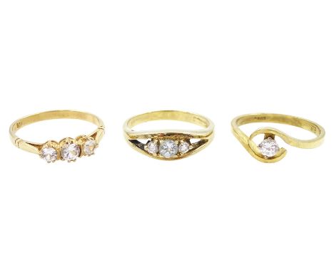 Gold single stone cubic zirconia ring, three stone white spinel ring, both 9ct and a silver-gilt three stone ringCondition Re