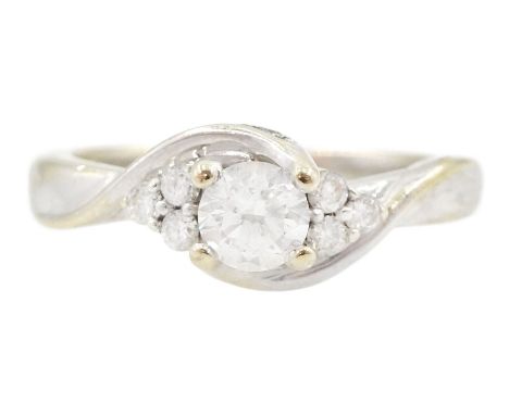 18ct gold round brilliant cut diamond ring, central diamond flanked by groups of smaller diamonds, hallmarked, principal diam