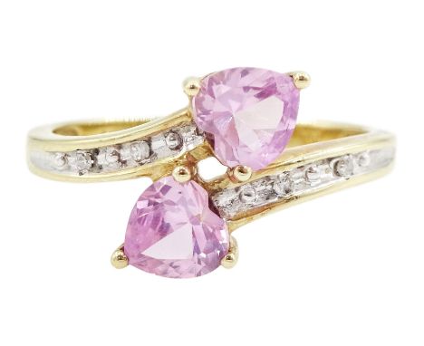 9ct gold two stone heart cut pink sapphire ring, with diamond set shoulders, hallmarkedCondition Report:Approx 2.2gm, size N,