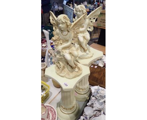 Pair of resin flower fairies on columns. Not available for in-house P&amp;P, contact Paul O'Hea at Mailboxes on 01925 659133 