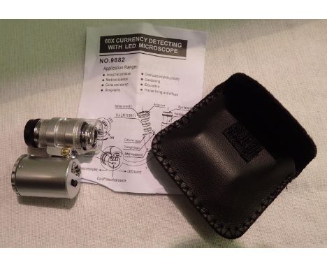 Cased 60x magnification currency/jewellers folding loupe with LED light and instructions. P&amp;P Group 1 (£14+VAT for the fi
