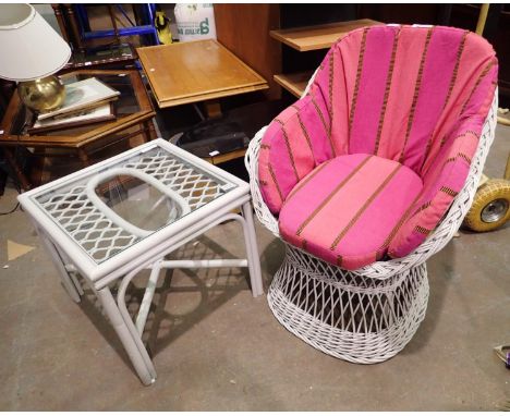 Light grey painted wicker chair with padded seat and back/arm cushions with matching glass topped coffee table. Not available