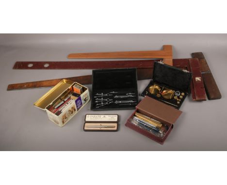 A collection of drawing equipment, to include draughtsman's squares, pen nibs, cased scales etc.  