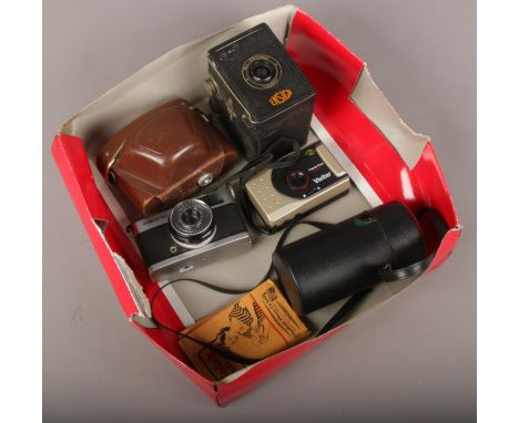 A box of camera equipment to include Ensign box camera, Olympus trip 35 camera, Komora lens etc.  