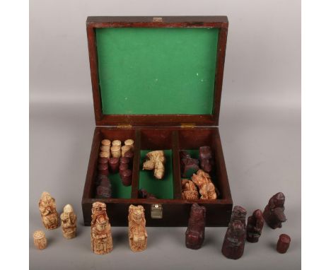 A reproduction Isle of Lewis chess piece set in wooden box (full set)  
