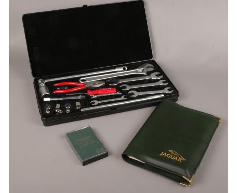 A Jaguar XJ6 (2.9-3.6) owners handbook, Tool kit with spanners, screwdriver, adjustable spanner etc, Stereo Radio cassette ow