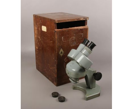 A cased Watson binocular microscope, model no. 134013.  