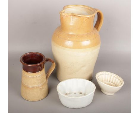 A collection of c19th stoneware to include large salt glazed pitcher, jelly moulds etc.  