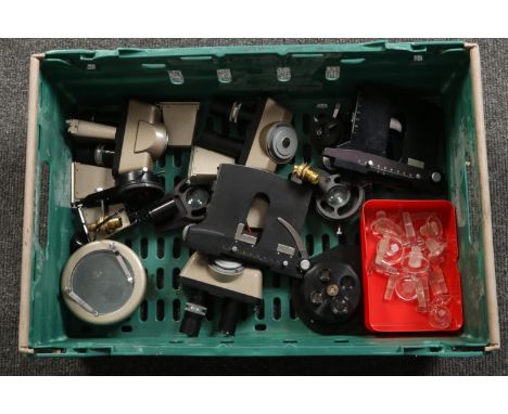 A box of microscope accessories and a collection of chemical bottle stoppers.  