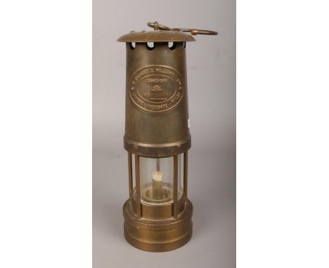 A Thomas &amp; Williams Ltd brass miner's lamp.  