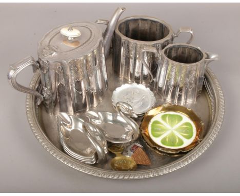 A group lot of metalwares to include silver plate teapot, silver plate circular tray, trinket dishes etc.  