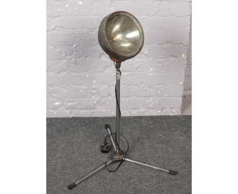 An industrial lamp on stand.  