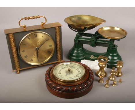 A carved mahogany circular wall barometer, along with a set of Librasco kitchen scales and brass weights and an ornate mantle