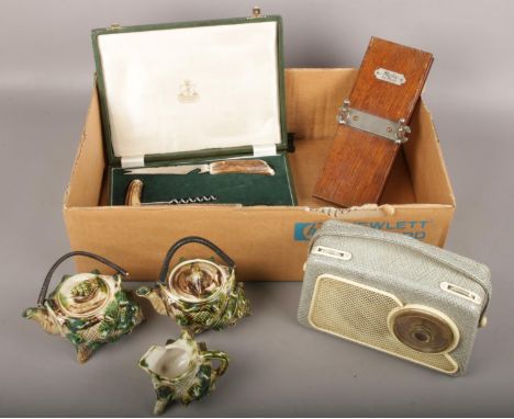 A box of miscellaneous, Mosley Tie press, Dansette 222 transistor, Samuel Peace cased cutlery, ceramic shell teapots and cup 