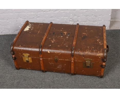A wood and metal bound travel trunk, stencilled J.A.T.  