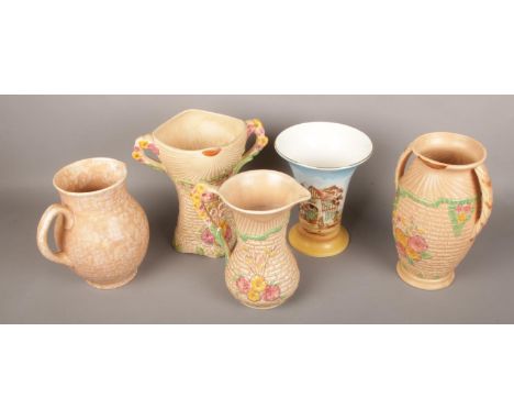 Three Arthur Wood ceramic jugs and one twin handle vase along with another Falcon ware vase.  