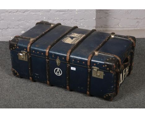 A vintage wooden bound travel trunk.  