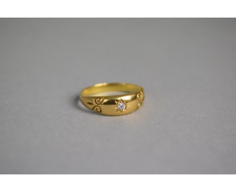 A Victorian Diamond and Yellow Metal Gypsy Ring, Having Central Diamond Chip and Scrolling Etched Decoration.. Re-shanked and