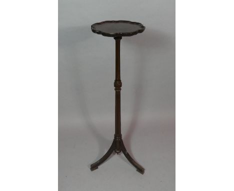 A Mahogany Candle Stand or Torchere with Turned Reeded Support on Tripod Base. 107cms High