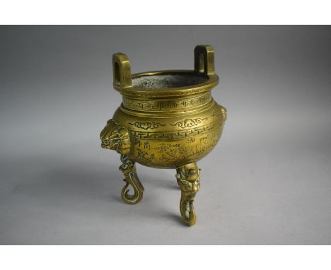 An Oriental Bronze Koro on Three Scrolled Lion Mask Supports 
