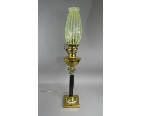 A Victorian Brass Oil Lamp with Ebonised Corinthian Column Support on Square Base. Yellow Vaseline Glass Shade. Converted to 