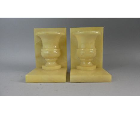 A Pair of Modern Onyx Book Ends with Half Vase Mounts, 17cm hgh&nbsp;