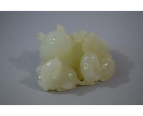 An Oriental Carved Jade Study of a Cat and Two Kittens, 5.2cms Long 