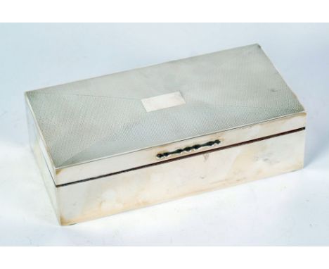 ENGINE TURNED SILVER CASED TABLE CIGARETTE BOX, with divided interior, Birmingham 1925, 7" x 3 ½" x 2" (17.8cm x 8.9cm x 5cm)