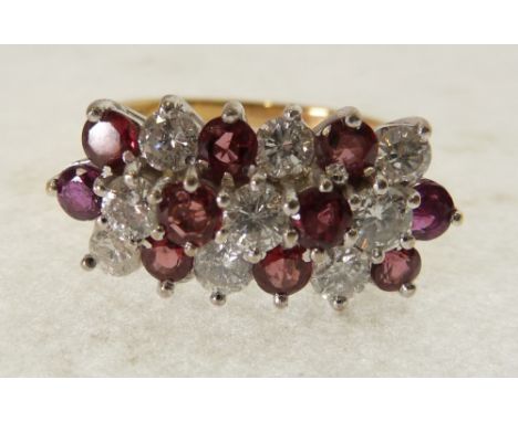 an 18ct YELLOW GOLD TINY DIAMOND AND RUBY SET RING, the white gold setting with seven alternate rows of respectively, a total