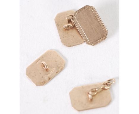 A PAIR OF 9ct GOLD ENGINE TURNED CUFF LINKS, double oblong with curved corners, Chester 1938 (one chain link broken) 6gms 