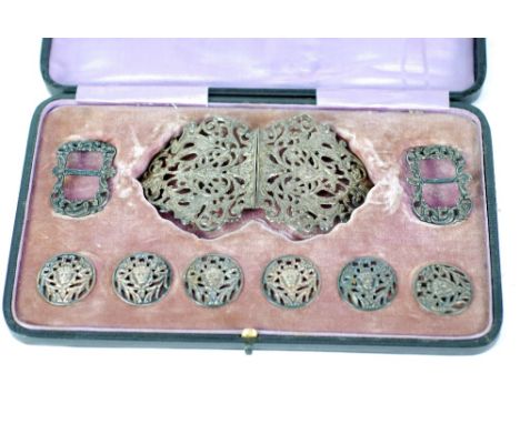 LADY'S CASED VICTORIAN SILVER BUCKLE AND BUTTON DRESS SET, ornate openwork foliate scroll and mask design, COMPRISING TWO PAR