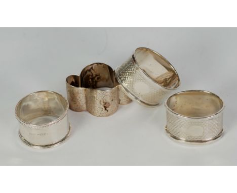 PAIR OF ENGINE TURNED SILVER OVAL NAPKIN RINGS, Birmingham 1933, A VICTORIAN BRIGHT CUT ENGRAVED QUATREFOIL NAPKIN RING AND A