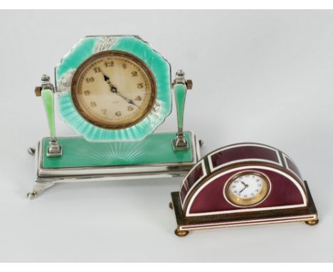 A CIRCA 1930's STERLING SILVER AND GREEN GUILLOCHE ENAMEL BEDSIDE CLOCK, and ANOTHER gilt metal and puce guilloche enamel bed