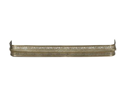 A VICTORIAN BRASS CURB FENDER, with pierced banding and cast gadrooning, raised on rim foot. 161 x 26 x 18cm high