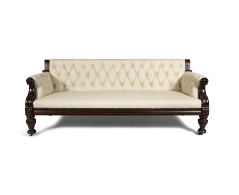 A IRISH WILLIAM IV MAHOGANY FRAMED BUTTON BACK SETTEE, of rectangular shape, covered in an cream leather, with leaf carved sc