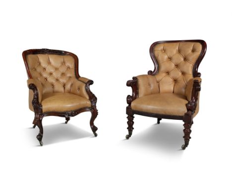 TWO VICTORIAN MAHOGANY FRAMED ARMCHAIRS, of similar style, each covered with brown button back hide, with arched padded backs