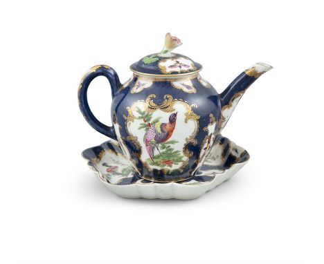 A WORCESTER PORCELAIN BACHELOR'S TEAPOT AND STAND, the deep blue ground decorated with panels painted with exotic birds withi