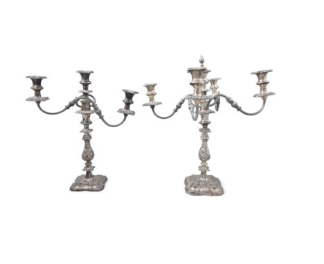 A PAIR OF SILVER PLATED CANDLESTICKS, 20th century, in the shape of a column with shaped-circular spreading foot, 18 cm tall 