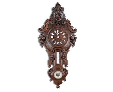 A VICTORIAN CARVED OAK WALL CLOCK, c.1880, headed with a lion mask over a circular dial with enamel numeral batons over a the