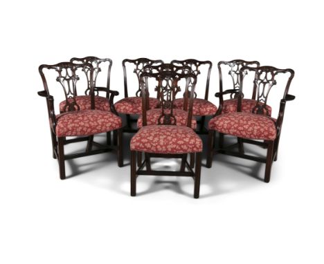 A SET OF EIGHT GEORGE III MAHOGANY FRAMED DINING CHAIRS, in the Chippendale taste, 19th century, the pierced splat backs with