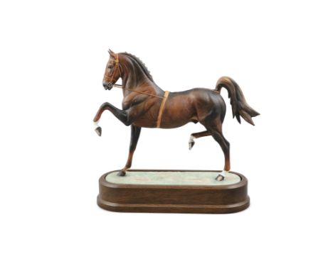 A ROYAL WORCESTER PORCELAIN MODEL OF A HACKNEY STALLION, modelled by Doris Lindner, model no.29/500, set into an oval timber 