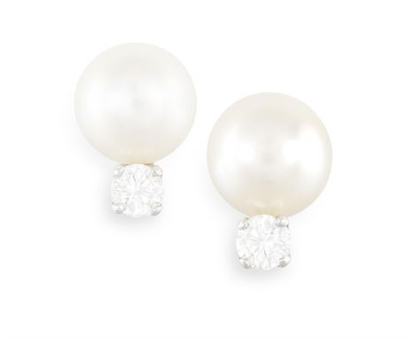 A PAIR OF CULTURED PEARL AND DIAMOND EARRINGS, each cultured pearl of cream tint measuring approx. 9.22mm, with brilliant-cut