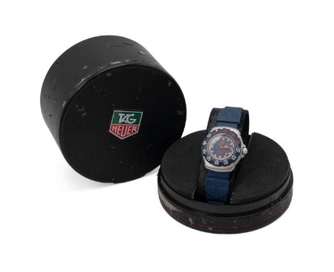 Tag Heuer Professional wristwatch in box. Ref 370.508, quartz, 28mm brushed steel case with blue bezel, dial and strap, date 