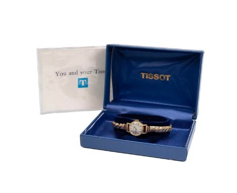 Ladies Tissot 18ct gold wristwatch in box, c1974. Manual wind, ref 17096612, 17mm 9ct gold case, silvered dial, gold tone bat