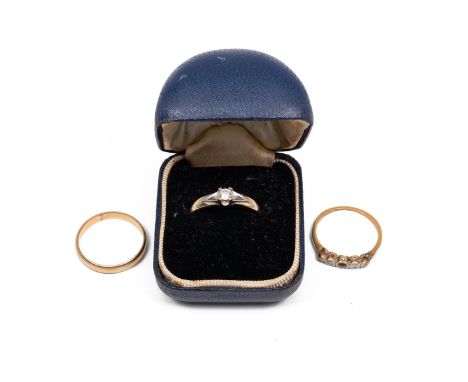 Two 9ct gold rings, one a wedding band and the other a five stone diamond ring (central stone missing), weight 3.3 grams; and