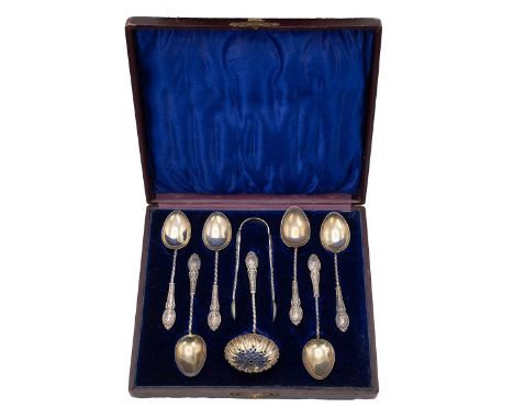 Cased set of silver gilt coffee spoons, nips and sifter. In original blue velvet-lined case, hallmarked Birmingham 1874, make